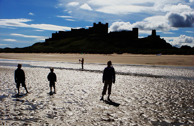 a silohuette of Bamburg castle from the beach.