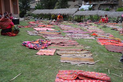the women all spread out their woven goods for us to see
