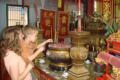 Benji and Meredith placing a incense stick