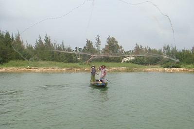 a fisherman casting his net