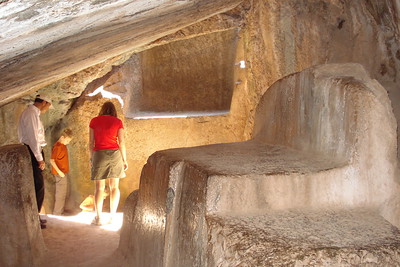 checking out an Incan sacrificial offering stone in a cave