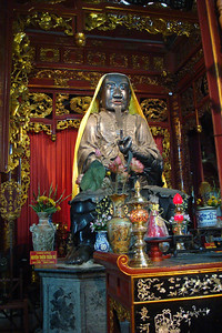 the staute of the North god at Quan Thanh temple guarding the north of Hanoi