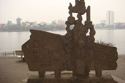a simple concrete monument to John McCain who was shot down over this lake