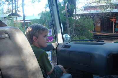 Benji sitting up front for a drive through Undara with our guide Levi