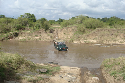 crossing the rain swollen river