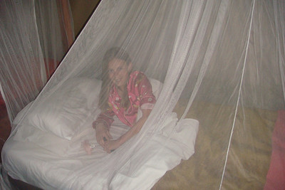 Alayna under her mosquito net
