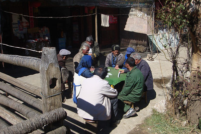 it was definitely leisure time for the men, playing mahjong...