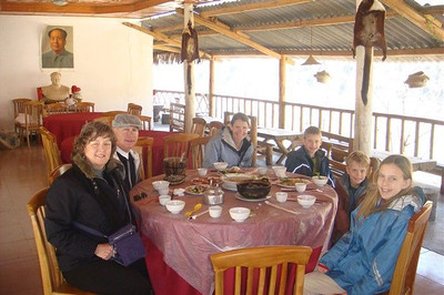 having lunch under the watchful eye of Chairman Mao