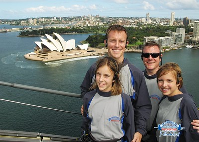 the dads and girls at the top of the bridge