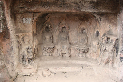defaced Buddhas at the Thousand Buddha Cliffs
