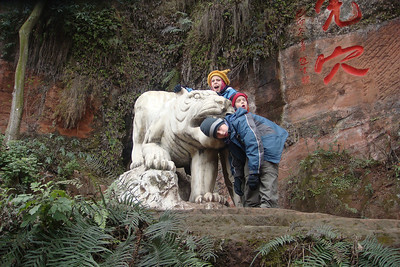 the kids narrowly escape a white tiger attack on the way to the Giant Buddha