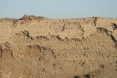 remains of an ancient mud brick wall around the temple