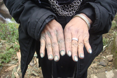 her hands are stained from indigo dye
