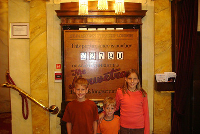 posing in front on the Mousetrap sign