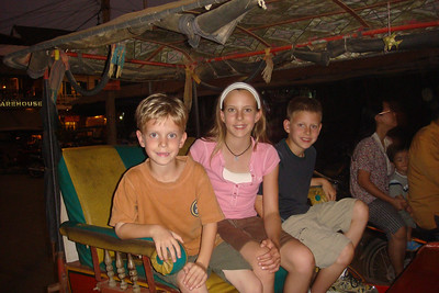 taking a ride on a tuk tuk