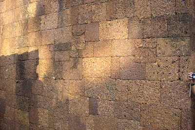 a wall of irregularly shaped shaped laterite stones