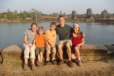 posing across the moat from Angkor Wat