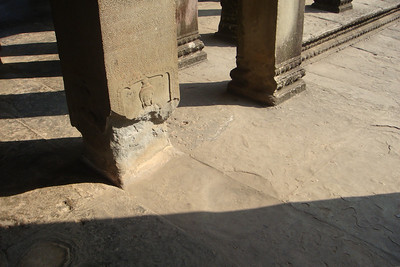 many of the sandstone column bases have been damaged by water