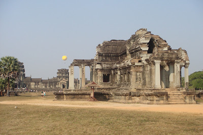 the balloon rising behind a library