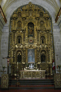 the altar screen with an Incan sun idol in the center