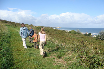 climbing up to a cliff overlooking Omaha Beach