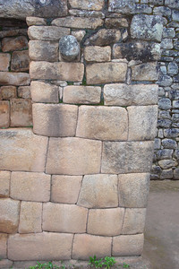 before reconstruction the walls were about 6 feet high, the rough stones were put back on top