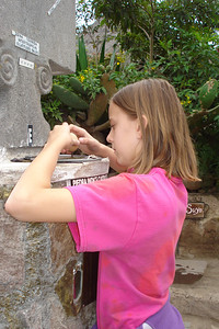 Alayna trying to balance an egg on a nail right on the equator