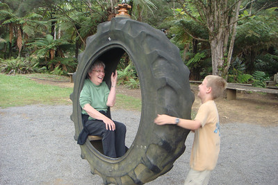 Nate giving Grandmomma a ride in a tire swing
