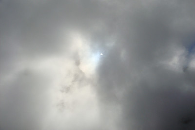 the sun breaking through a cloud of steam