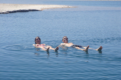 Clay and Meredith floating on top of the water like a couple of crocodiles
