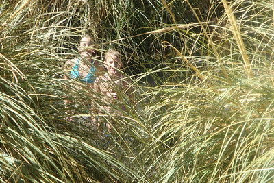 the kids' among the pampas grass at the Puritama hot water springs