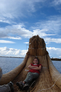 Alayna relaxing in the bow of a reed boat
