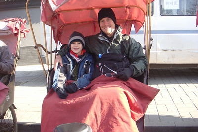 getting ready for a bicycle rickshaw ride through a hutong