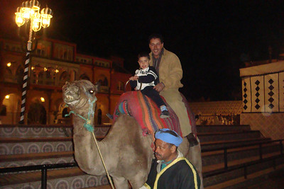 Mustafa and his son, Adam, getting a camel ride